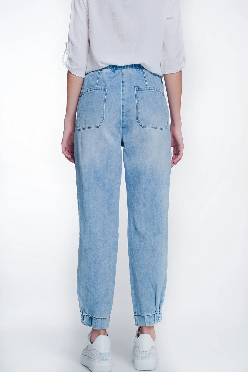 Heavily ripped boyfriend jeans in light denim