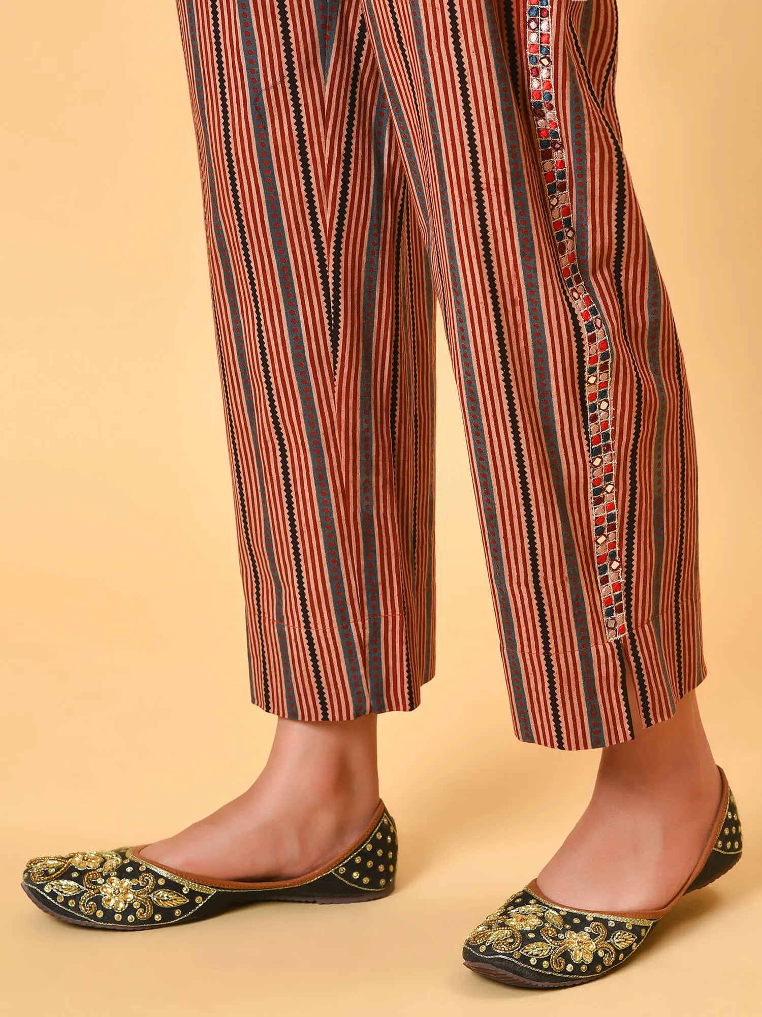 Indian apple cinnamon summer in a maroon ikat kurta pant and dupatta